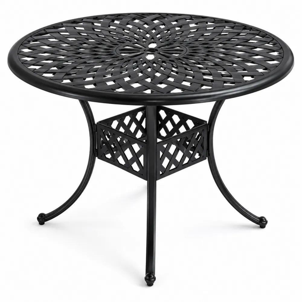 Table ronde en métal noir avec motifs ajourés pour extérieur